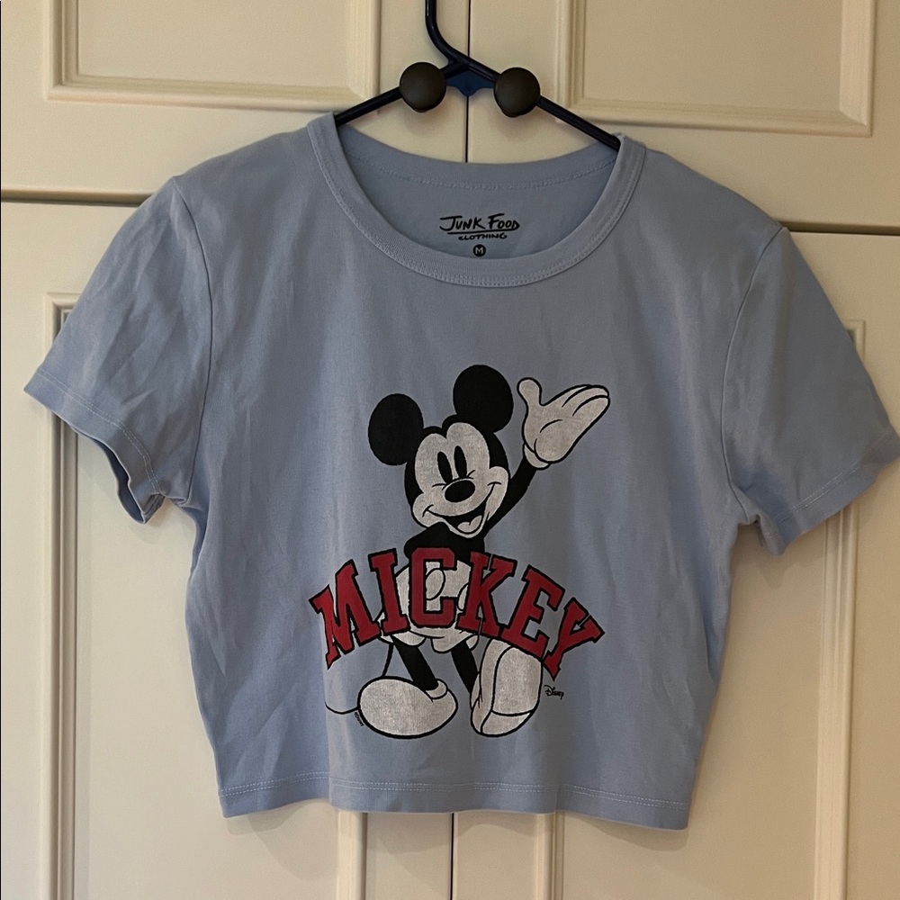 Junk Food Clothing Woman’s cropped Mickey Mouse Light Blue Tee